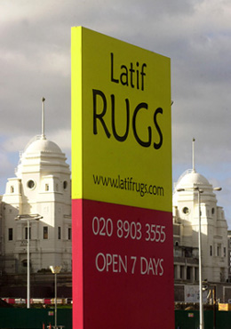 Latif Rugs outdoor Totem sign - Rugs direct to the public at wholesale prices - Modern rugs, Shaggy, Sheepskin, Persian, Needlepoint and many others. Buy Rugs Online.